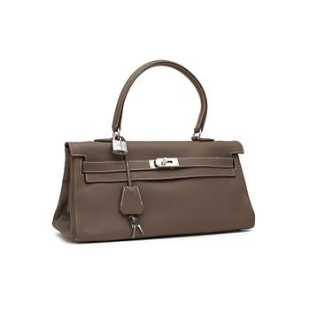 HERMÈS, a Clemence bullcalf "JPG Shoulder Kelly" in the colour "Etoupe".