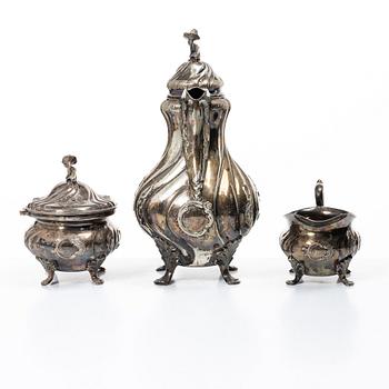 C.G. Hallberg, A three piece Roccoco style silver coffee service, Stockholm 1946.