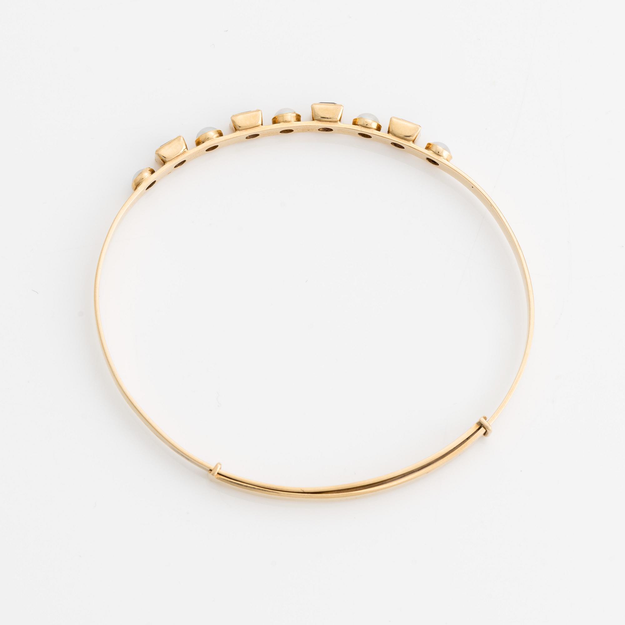 Armring, 18K guld med pärlor och ametister. Stockholm 1964.