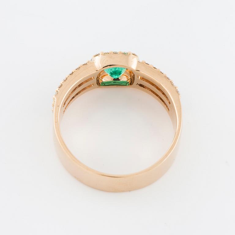 A faceted emerald and brilliant cut diamond ring.
