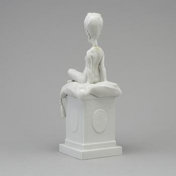 A white glazed Royal Copenhagen porcelain nodding head figure, Denmark, early 20th Century. Not first quality.