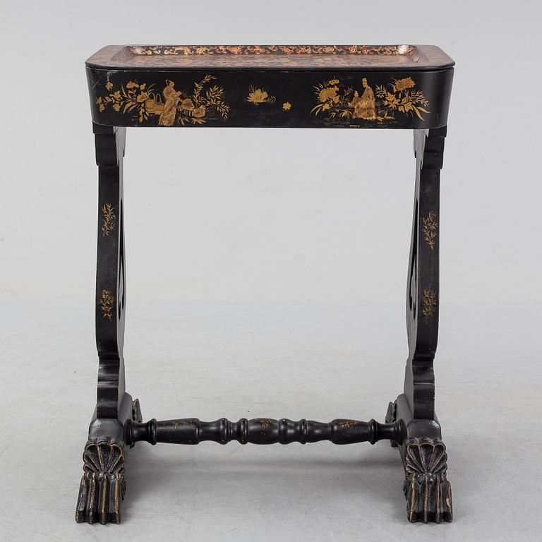 A black chinoiserie sewing table, second half of the 19th Century.