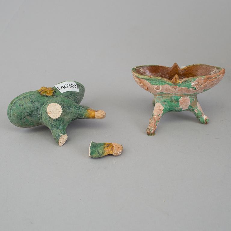 A group of eight chinese figures with three objects, earthenware, Ming dynasty.