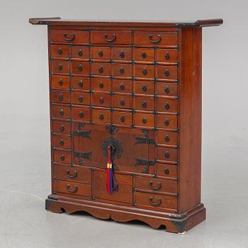 A contemporary Chinese spice cupboard.