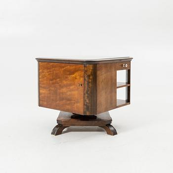 Rotating table with fitted bar, 1930s/40s.