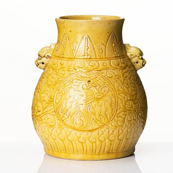 A yellow glazed phoenix vase,  Qing dynasty, with a Kangxi mark.