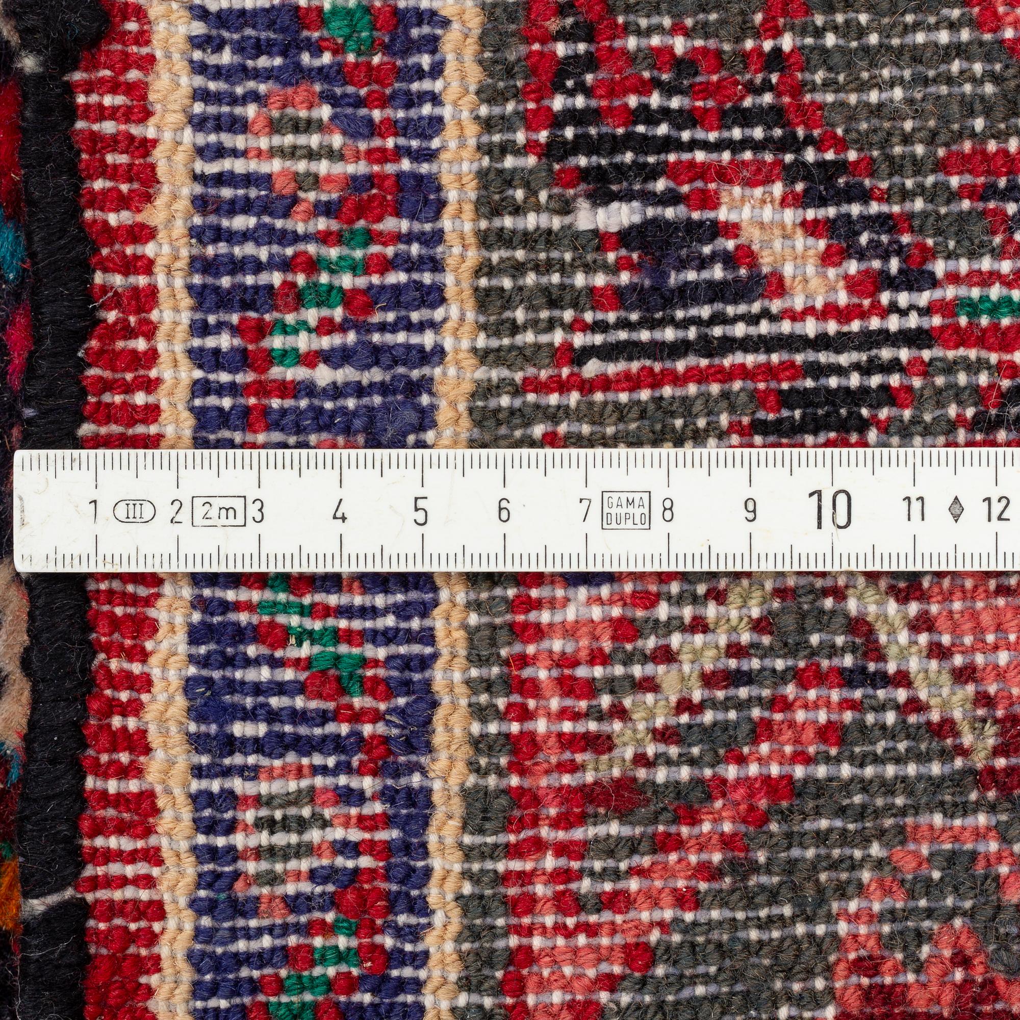 Rug, Hosseinabad, circa 310 x 112 cm.