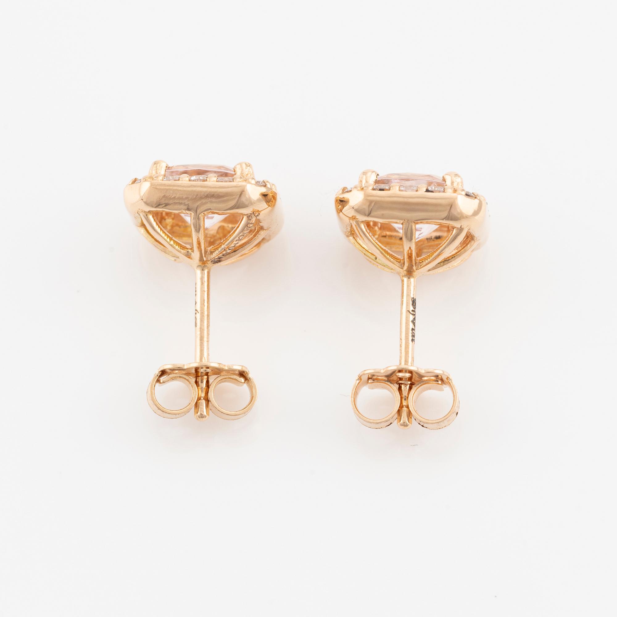 Ett par örhängen 18K guld med fasettslipade morganiter och runda briljantslipade diamanter.