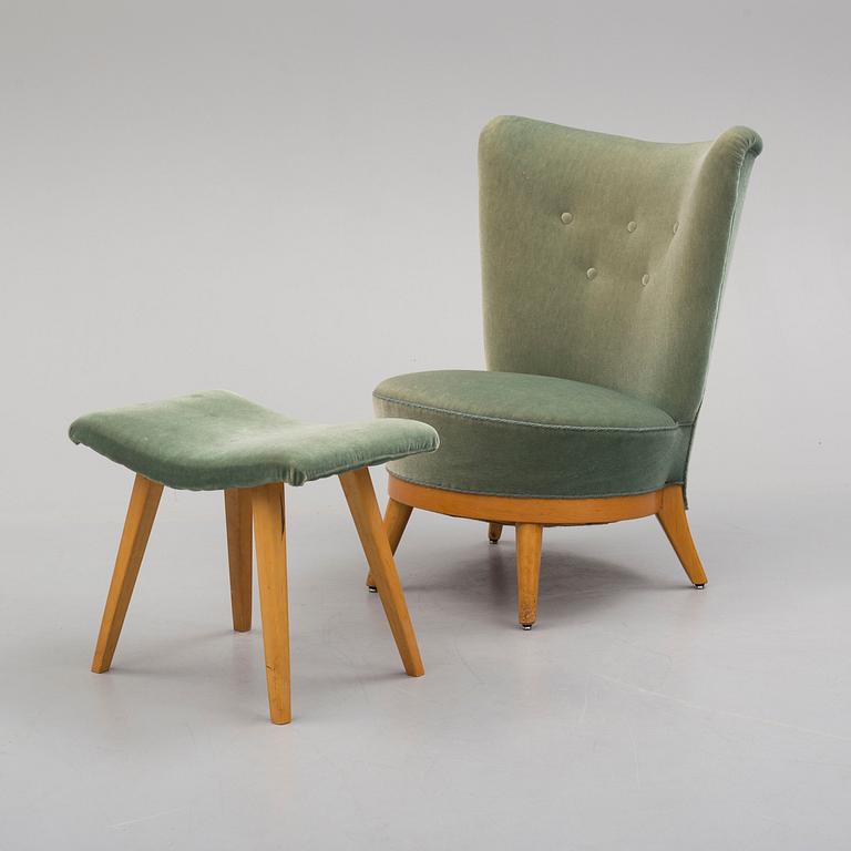 a mid 50th century easy chair with stool.