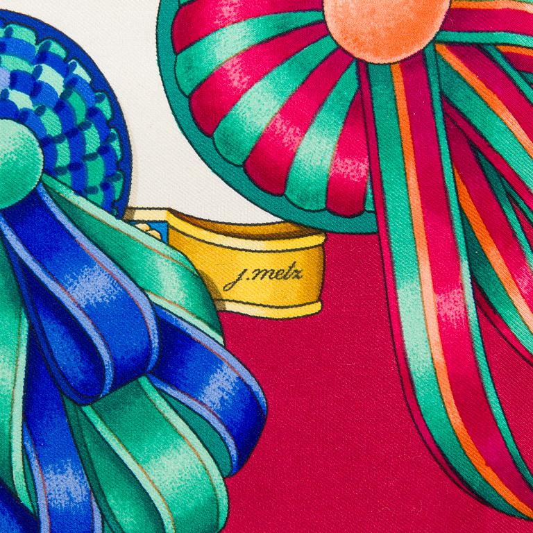 Hermès, a 'Les Rubans du Cheval' silk scarf.