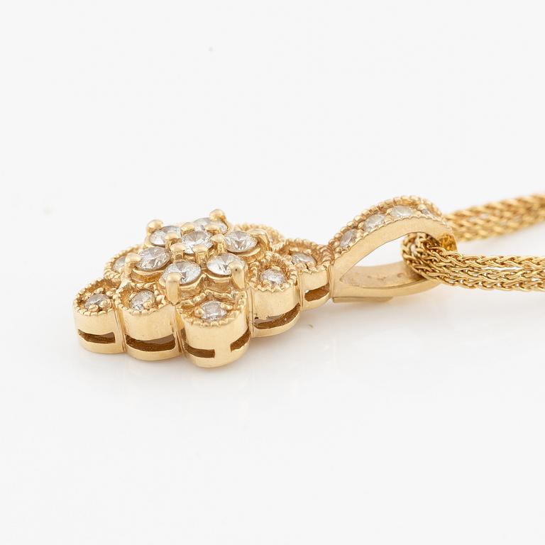 Pendant with chain in 14K gold set with round brilliant-cut diamonds.