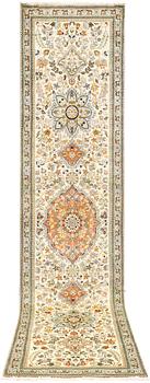 A Tabriz runner, c. 320 x 75 cm.