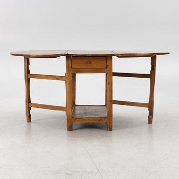 An 19th century drop-leaf table.