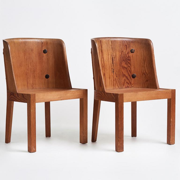 Axel Einar Hjorth, a pair of stained pine "Lovö" chairs, Nordiska Kompaniet, 1930's.