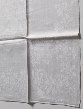 A TABLE CLOTH AND NAPKINS, 24 pieces, linen damask, the table cloth is dated 1827, ca 560-567 x 207,5 cm, Sweden 1827.