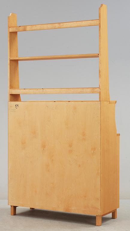 SKÅP MED HYLLA. Carl Malmsten, Åfors Möbelfabrik.