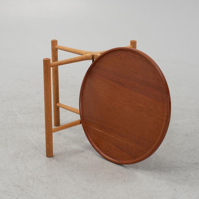 Hans J. Wegner, a model PP35 teak and oak tray table, Andreas Tuck, Denmark, mid 20th Century.
