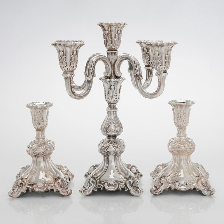 A 5-candle silver candelabra and a pair of candlesticks, silver, Auran Kultaseppä, Turku 1984.