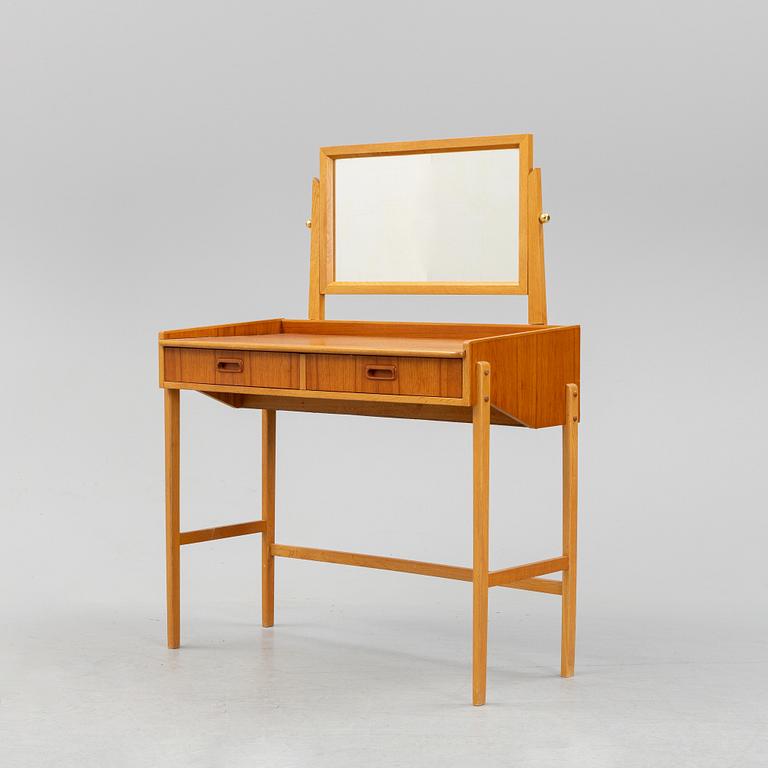 A teak make-up table from the second half of the 20th-century.