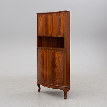 a mahogany corner cabinet.