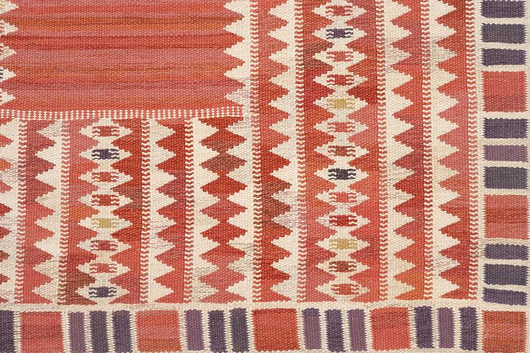Barbro Nilsson, a carpet, 'Salerno röd', flat weave, c. 261 x 193 cm, signed AB MMF BN.