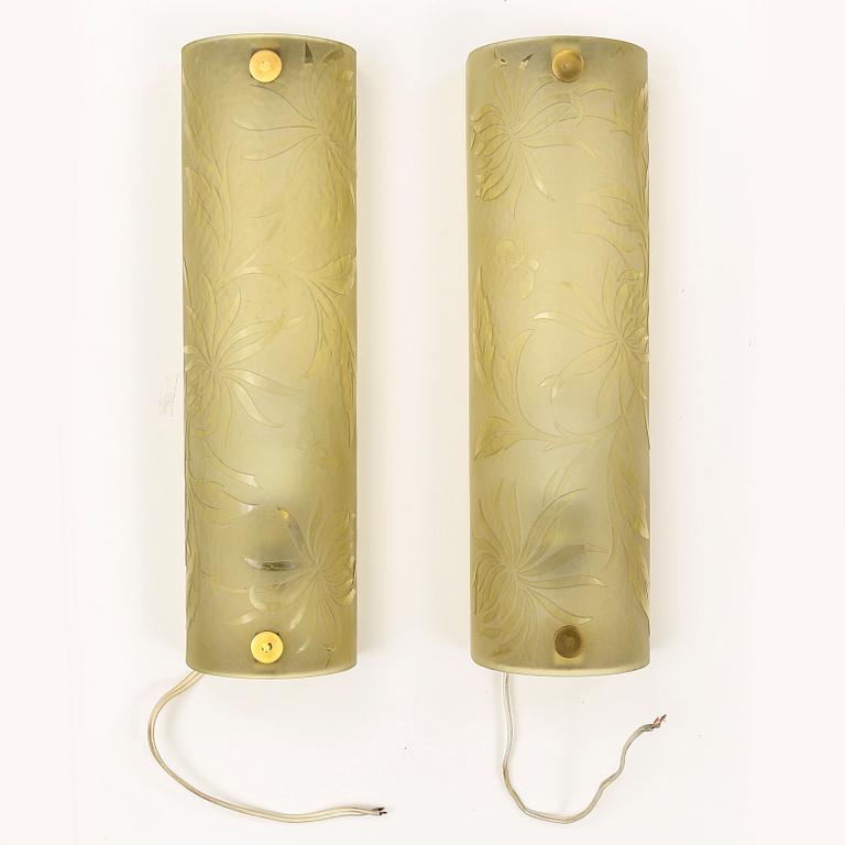 A pair of 1940s glass and metal wall lights.