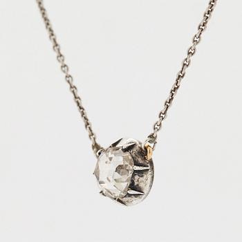 A pendant set with a rose-cut diamond.