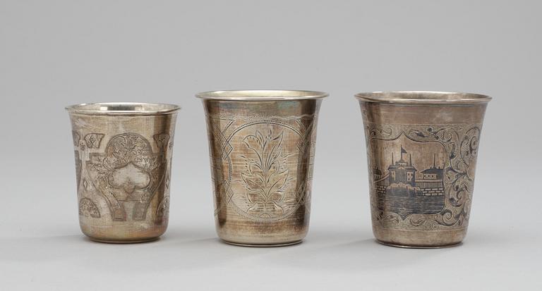 Three parcel-gilt and niello beakers, different makers, Moscow 1863-1895.