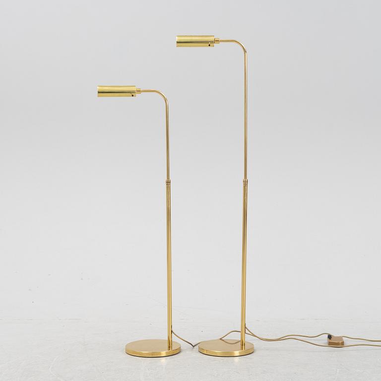 A pair of brass floor lamps, late 20th Century.