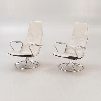 A pair of Tord Björklund Exen leather and chrome swivel chairs for IKEA 1988.