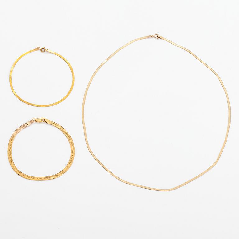 Two 14K gold bracelets and a 9K gold neckalce.