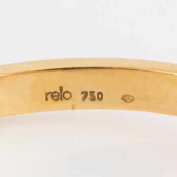 18K gold and brilliant-cut bangle.  Design Relo Luzern.