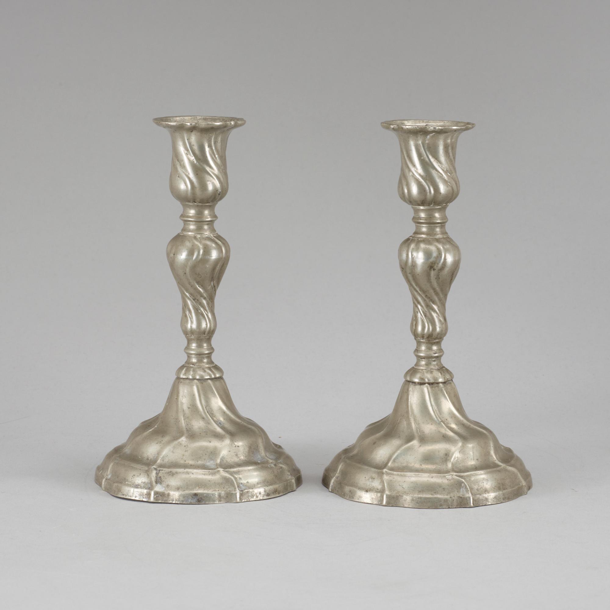 A pair of Rococo pewter candlesticks by Gudmund Östling (1762-1790).