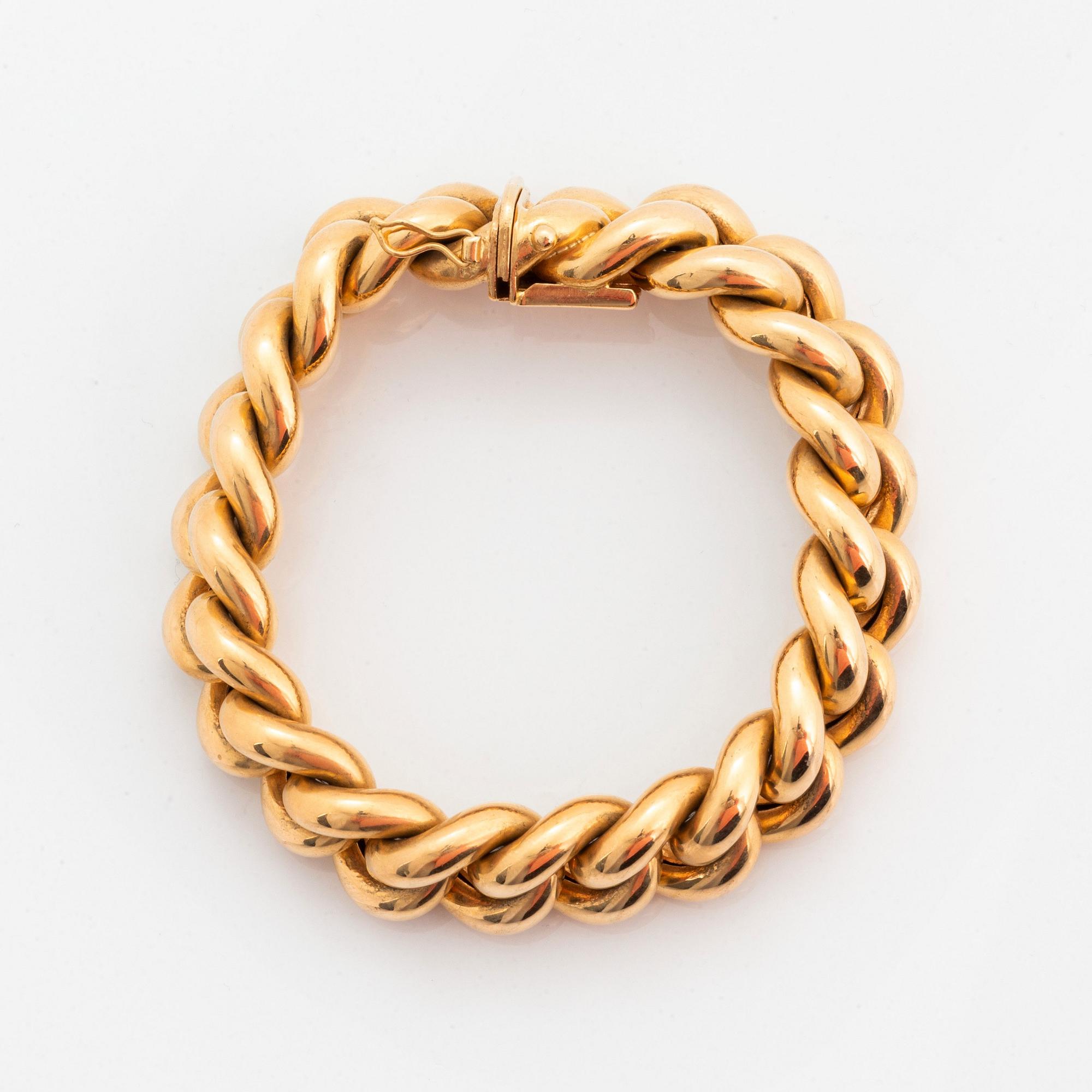 An 18K gold bracelet.