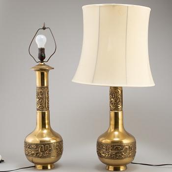 A pair of Chinese brass table lamps, 20th century.