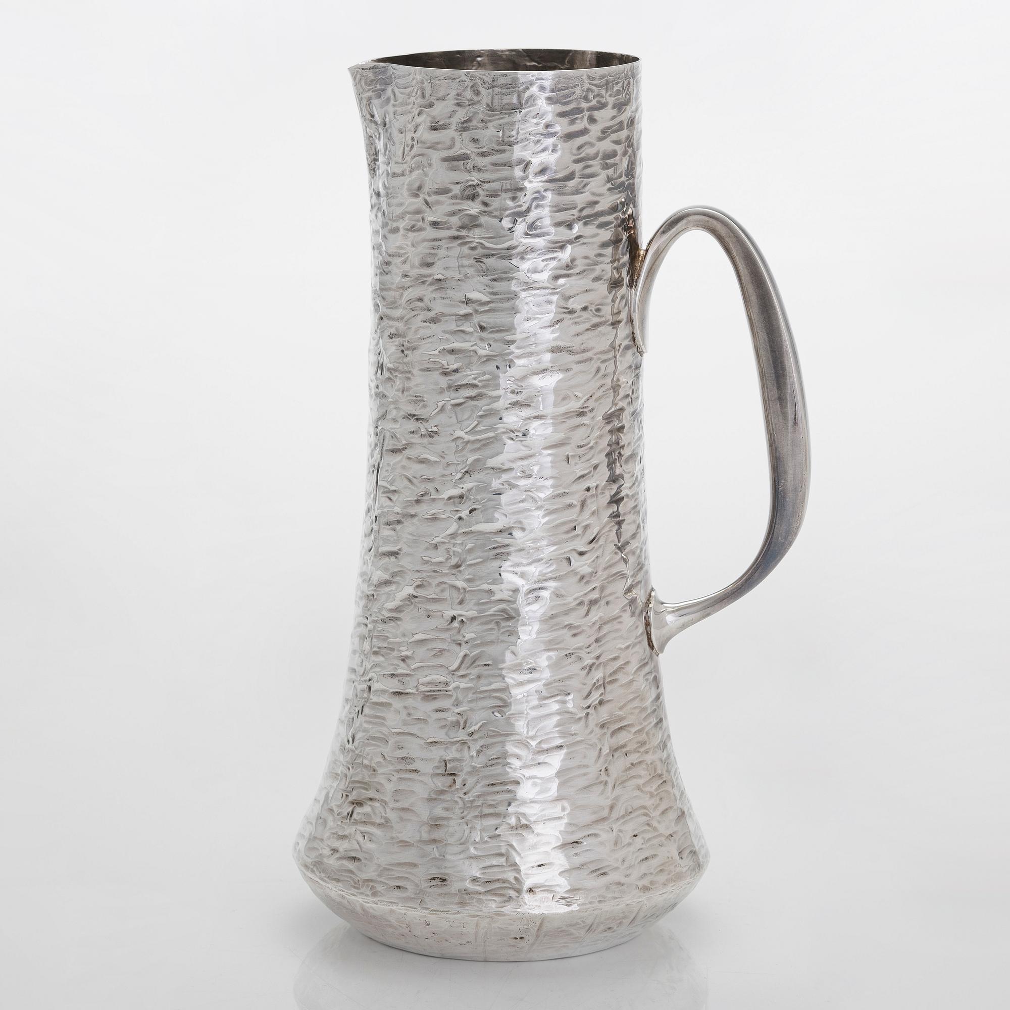 Tapio Wirkkala, a sterling silver pitcher with eight beakers, Hämeenlinna Finland 1973-1978.