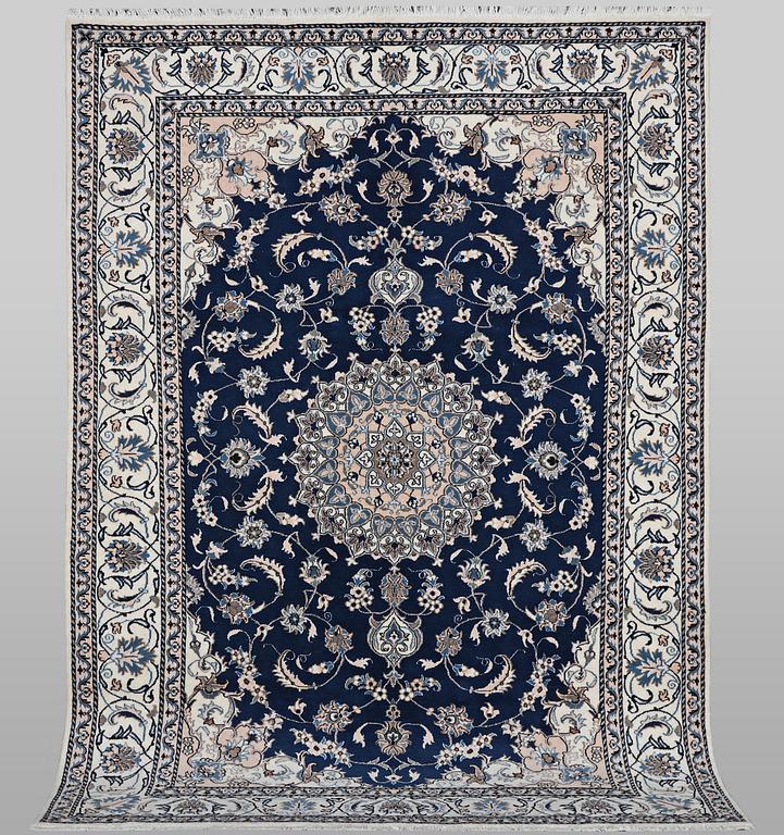 A carpet, Nain, part silk, ca 294 x 198 cm.