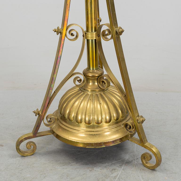 A floor brass paraffin lamp around 1900.