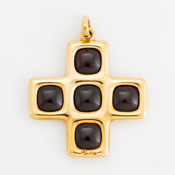 An 18K gold and garnet Pomellato cross.