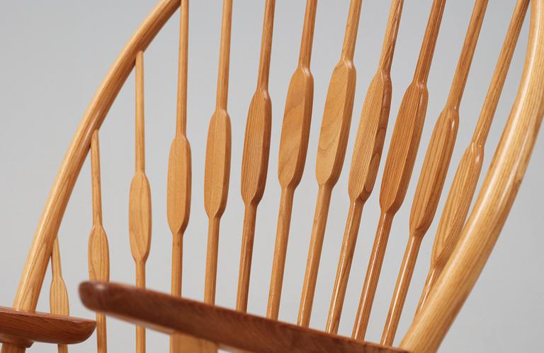 A Hans J Wegner ash and teak 'Peacock chair', Johannes Hansen, Denmark.