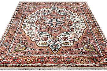 An oriental carpet with Mamluk design, c. 367 x 280 cm.