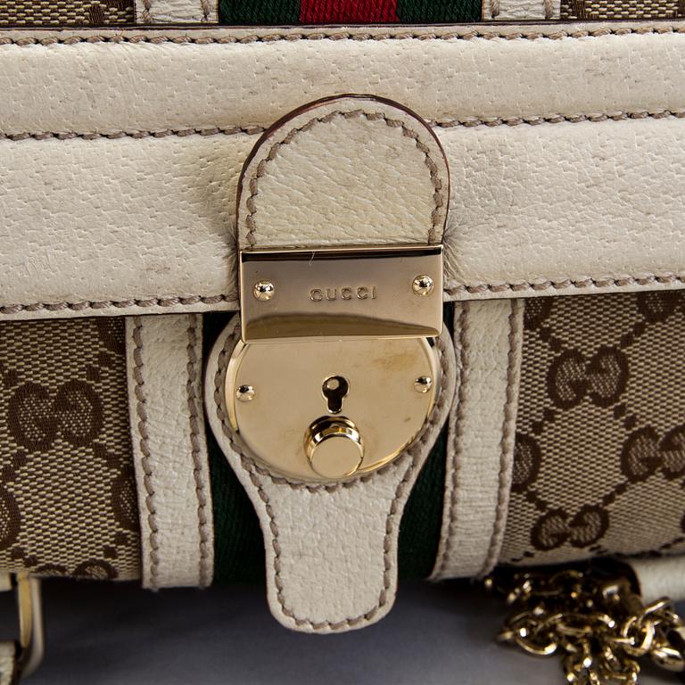 A Gucci canvas and leather hand bag.