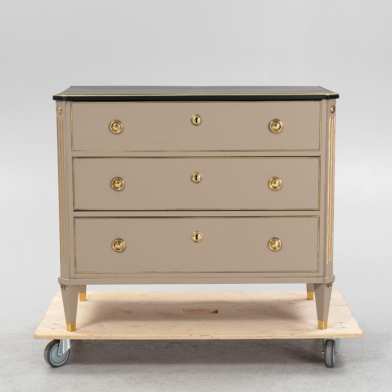 A painted Gustavian style chest of drawers from around the year 1900.