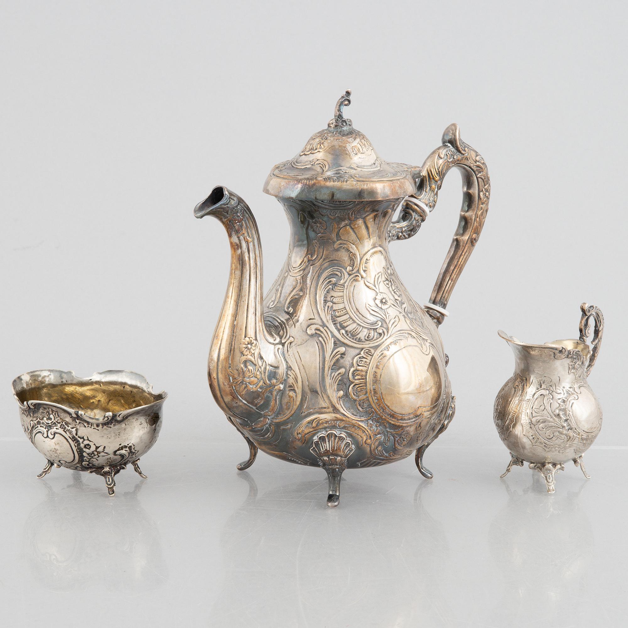 A silver coffee pot, creamer and sugar bowl, including GEWE, Malmö 1973. Rococo style.