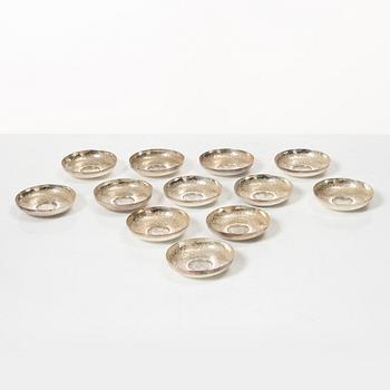 12 silver ashtrays with inlaid coins, silver, Pakistan, mid 20th century.