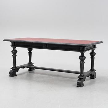 A renaissance style library table, around 1900.