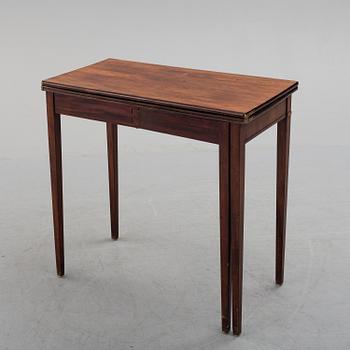 An early 19th century mahogany card table.