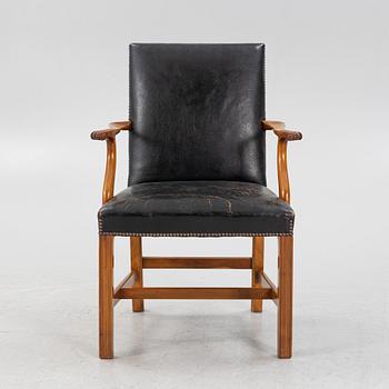 A leather upholstered armchair, 20th Century.