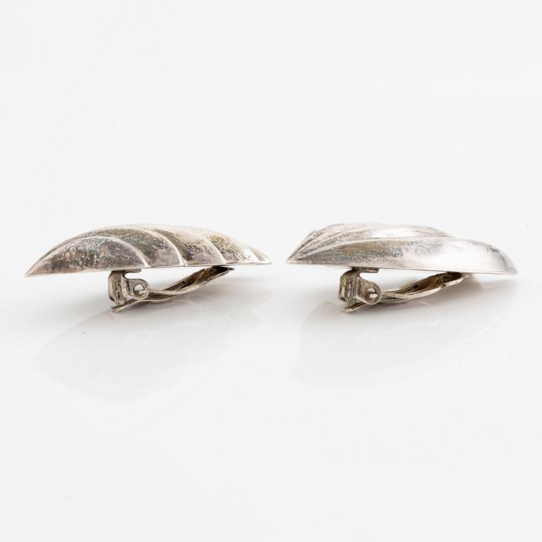 Earrings, silver, in the form of stylised leaves.