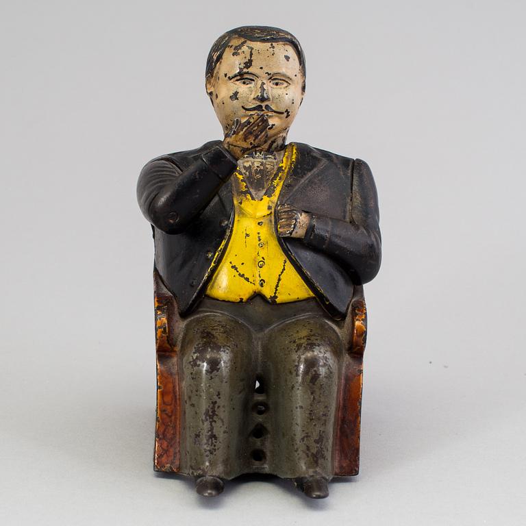 A Moneybox, cast iron, late 19th century.